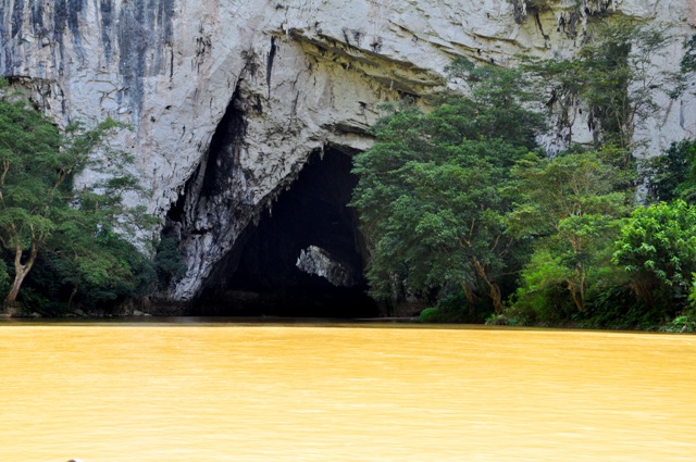 A tourist boat enters Puong Cave on Nang river